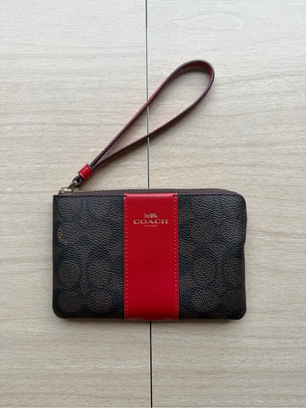 COACH Brown Signature Wristlet with Red Center Stripe